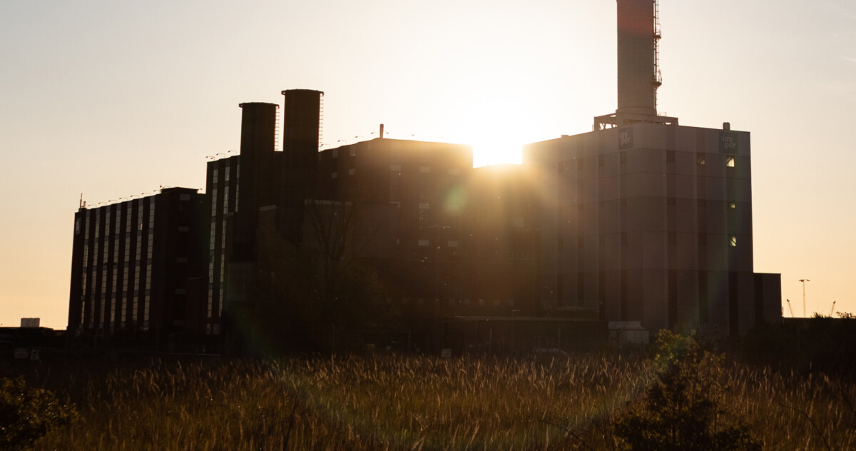 old factory with wheat field around it