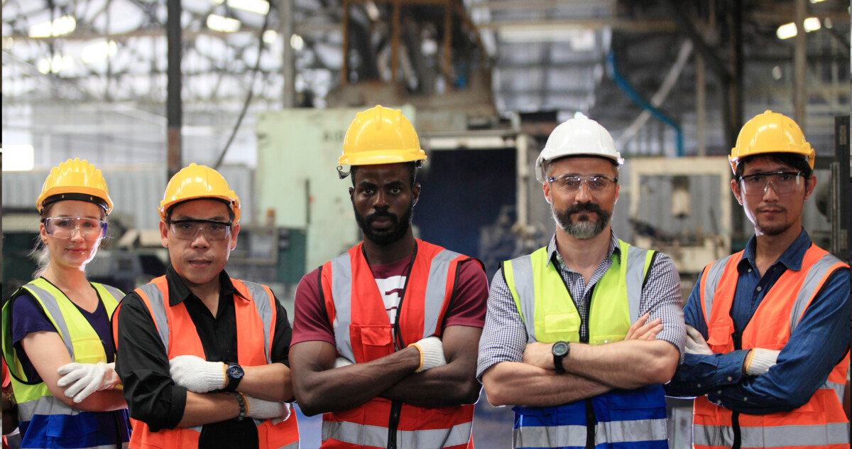 Construction workers smiling at construction site