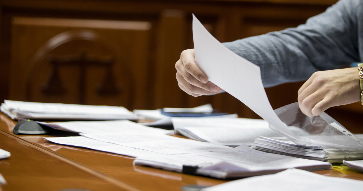 Lawyer sorting through legal documents
